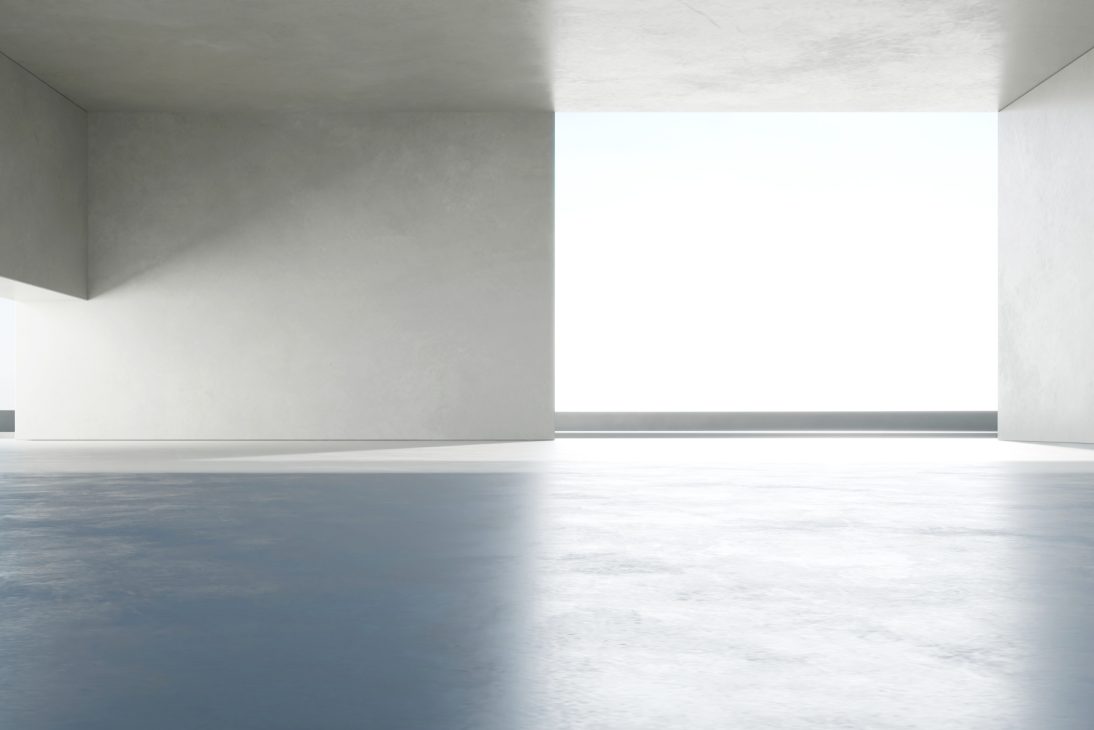 Interior minimalista com grandes janelas e luz natural em tons neutros. Espaço aberto moderno e elegante.