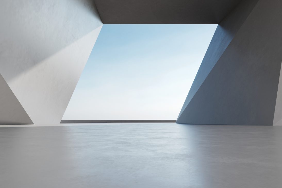 Estrutura geométrica moderna com abertura, céu azul visível ao fundo. Design minimalista e linhas elegantes.