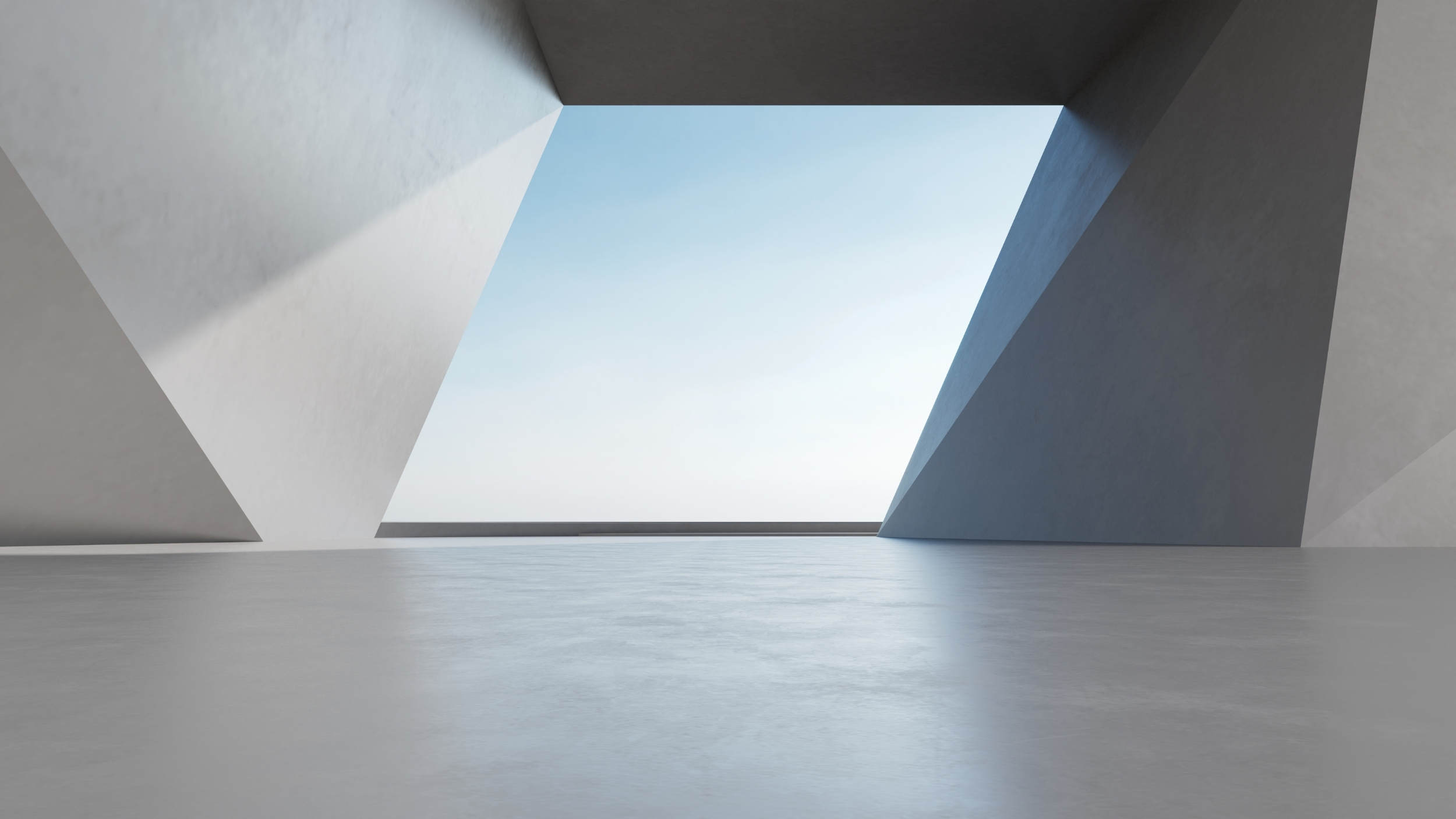 Estrutura geométrica moderna com abertura, céu azul visível ao fundo. Design minimalista e linhas elegantes.
